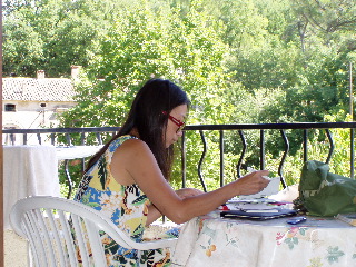 Writing postcard from the balcony of our gite in Venasque